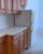 5. Ruang dapur dilengkapi kabinet dapur berelemen kayu