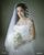 1. hari pernikahannya, Jessica Iskandar mengenakan gaun berwarna putih rancangan desainer Monica Ivena