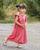 7. Tampil manis dalam balutan long dres pink
