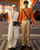 1. Orange outfit, penampilan kompak Rey Dinda saat tengah menyebrang jalan