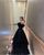 7. Tampak glamor menggunakan black tulle gown