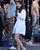 7. Masih gaun putih, kali ini Selena mengenakan kemeja panjang high heels silver