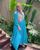 4. Jangan takut padukan warna, Nycta Gina padukan hijab segi empat warna abu gaun biru terang