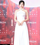 6. Personil girlband Yujin IVE tampil memikat dalam balutan halter white dress
