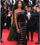 7. Naomi Campbell mengenakan gaun hitam detail sheer bagian rok