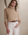 2. Tampil effortlessly chic pakai nuansa warna netral turtleneck sweater