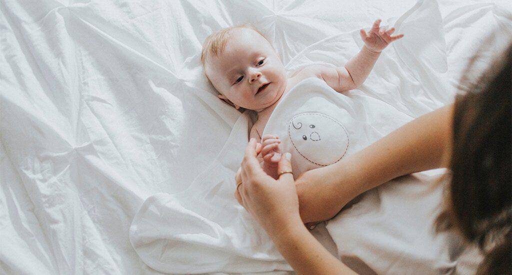 Cara membedong bayi - nestedbean.com