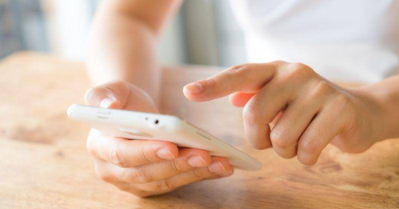 hands touching smartphone.jpg