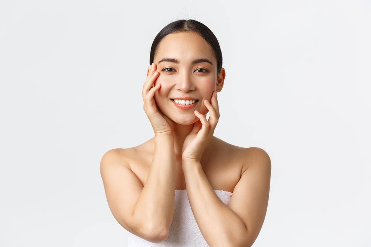 gorgeous-sensual-asian-woman-towel-touching-face-smiling-applying-skincare-products-cosmetic-procedure-spa-salon-massaging-face-gazing-camera-happy-white-background.jpg
