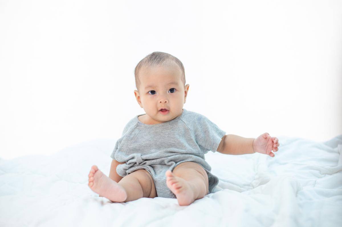 little-boy-sitting-bed.jpg