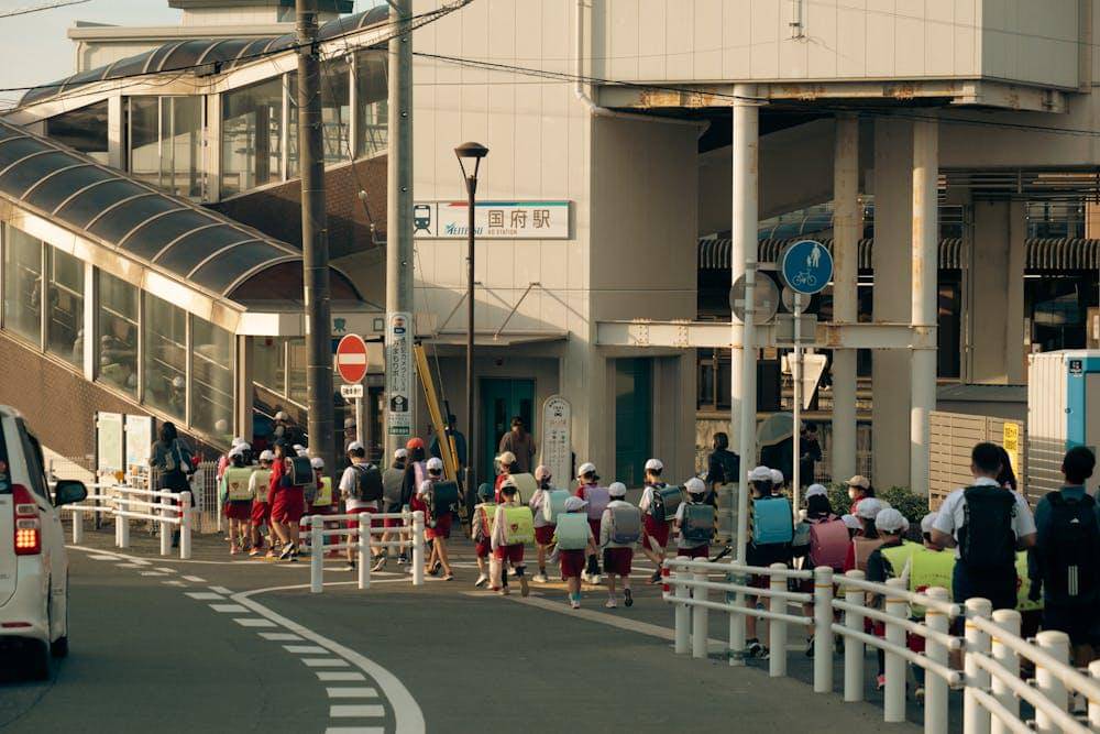 children walking at train station in toyokawa