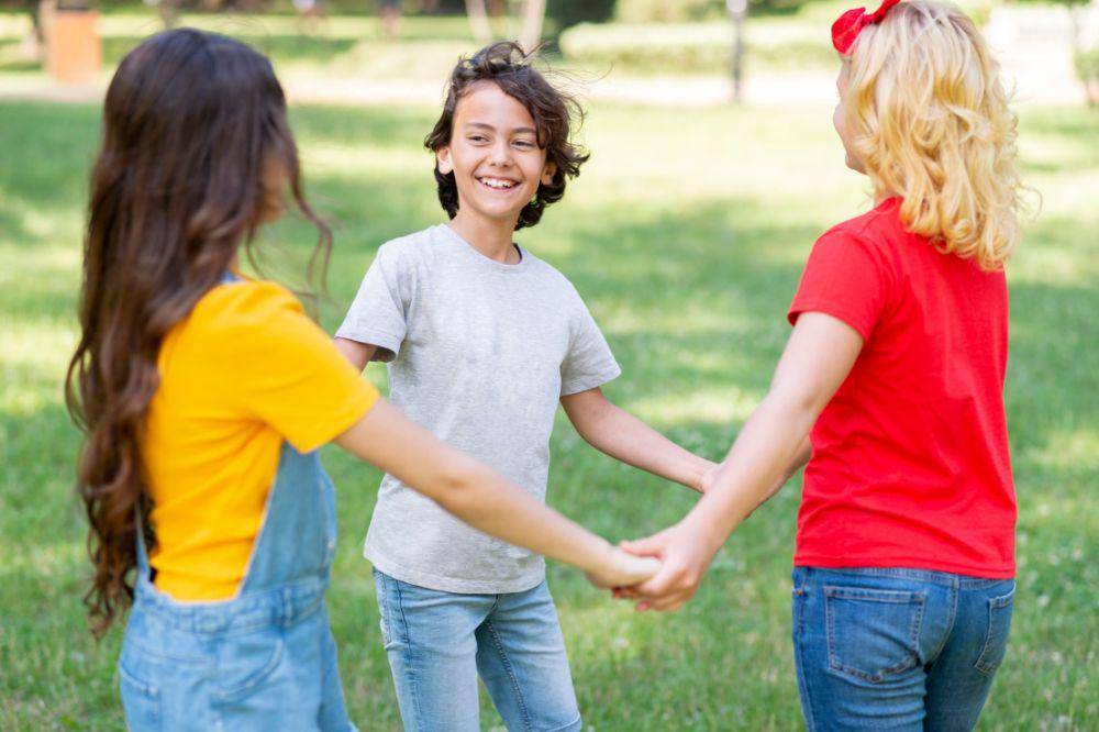 High angle childrens holding hands