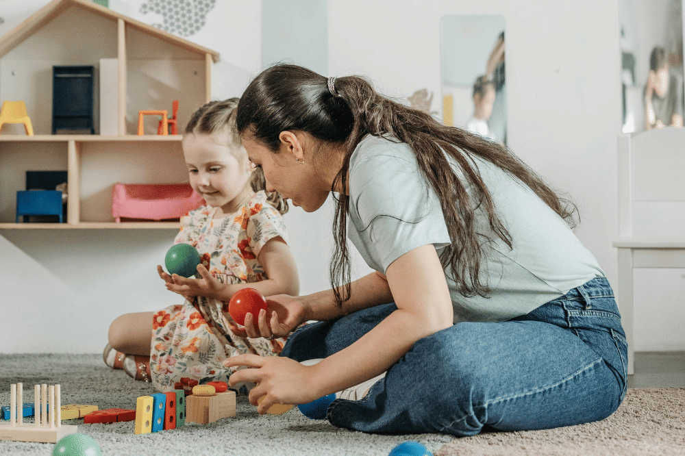 Anak dan guru bermain bola