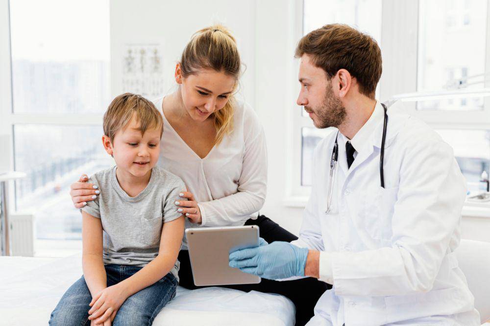 Medium shot doctor holding tablet