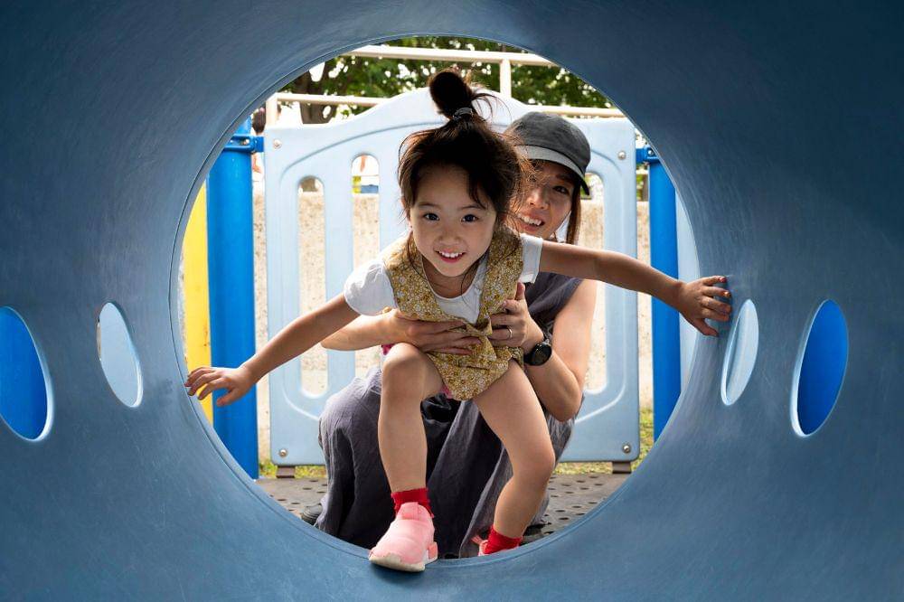 kid playing with mom