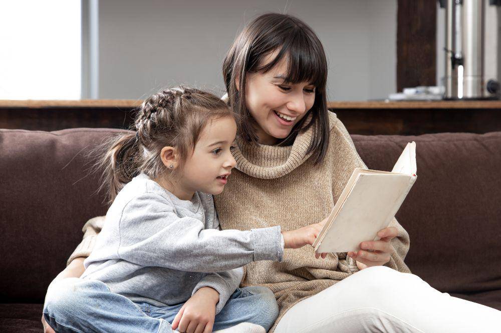 Mom and daughter spend time together reading a book
