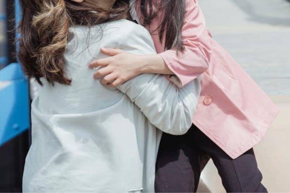mother and daughter playing a the playground