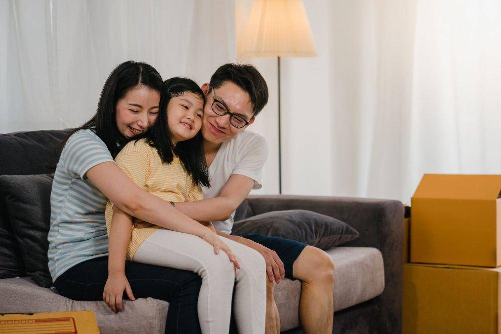 Happy asian young family
