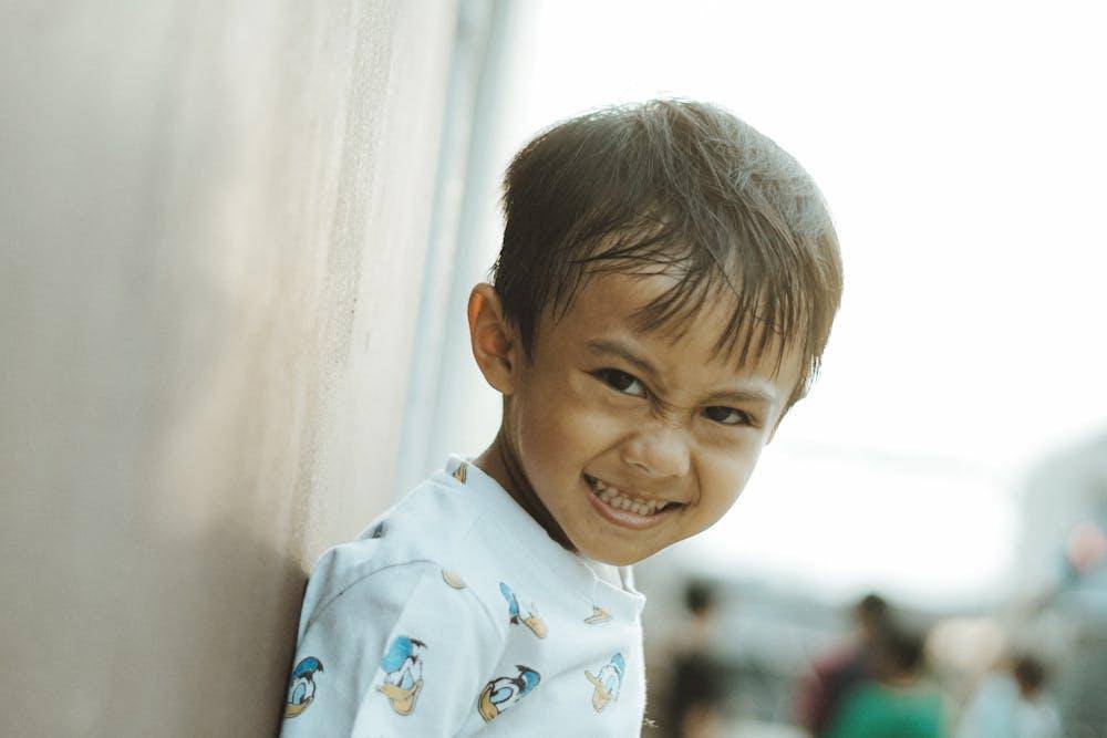 cheerful child smiling outdoors in west java