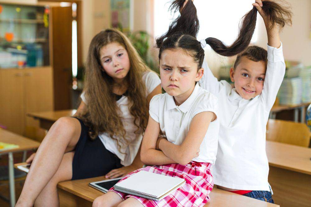 Schoolkids posing in classroom