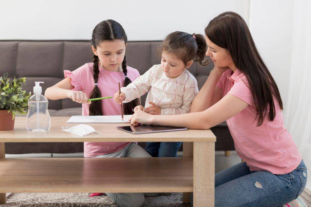 mother and girls at table