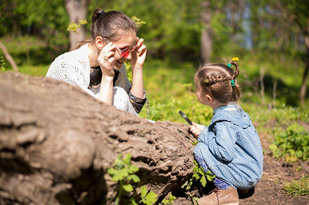Happy mother with kid in nature