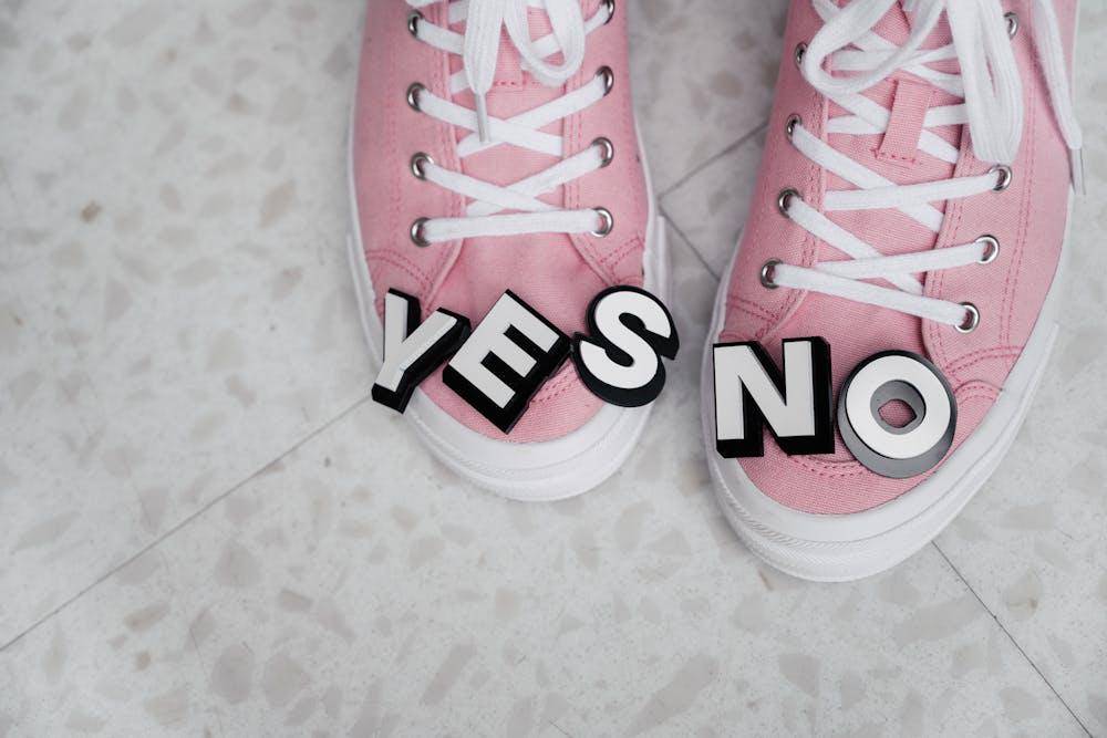 pink and white sneakers