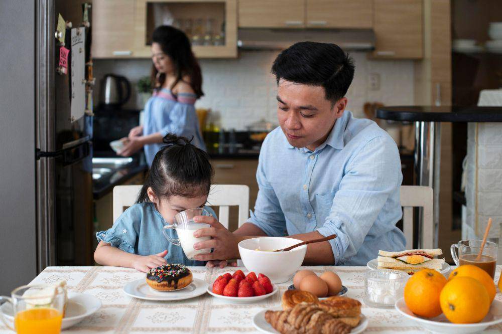 parents and kid in kitchen