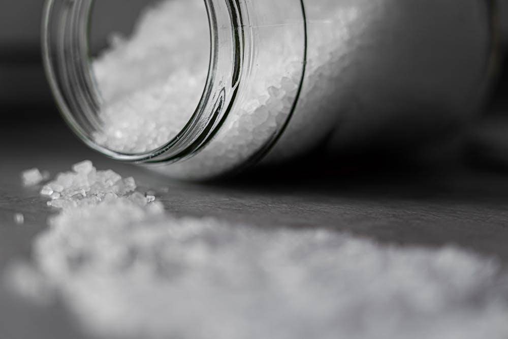 selective focus photo of salt in glass