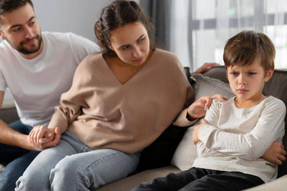 Parents and sad kid
