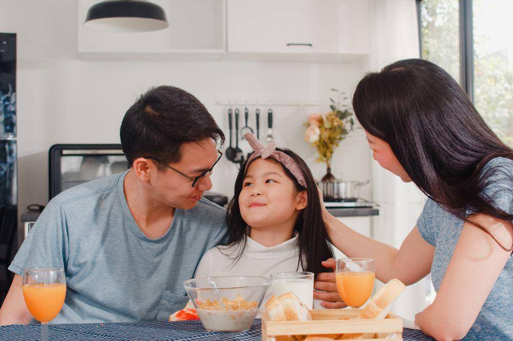 family has breakfast at home