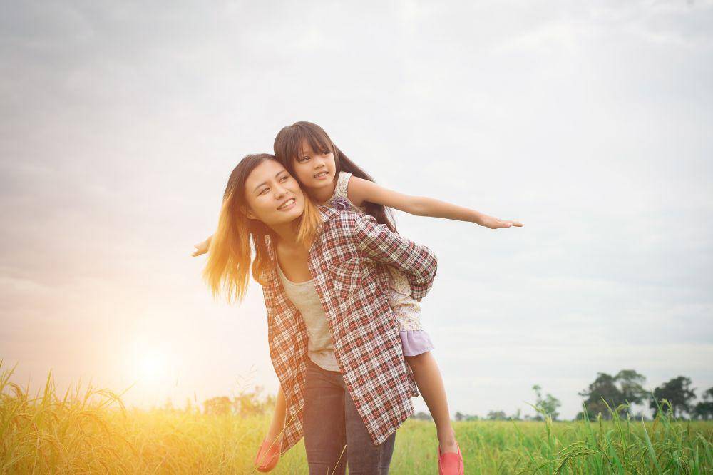 mom and daughter playing outdoor