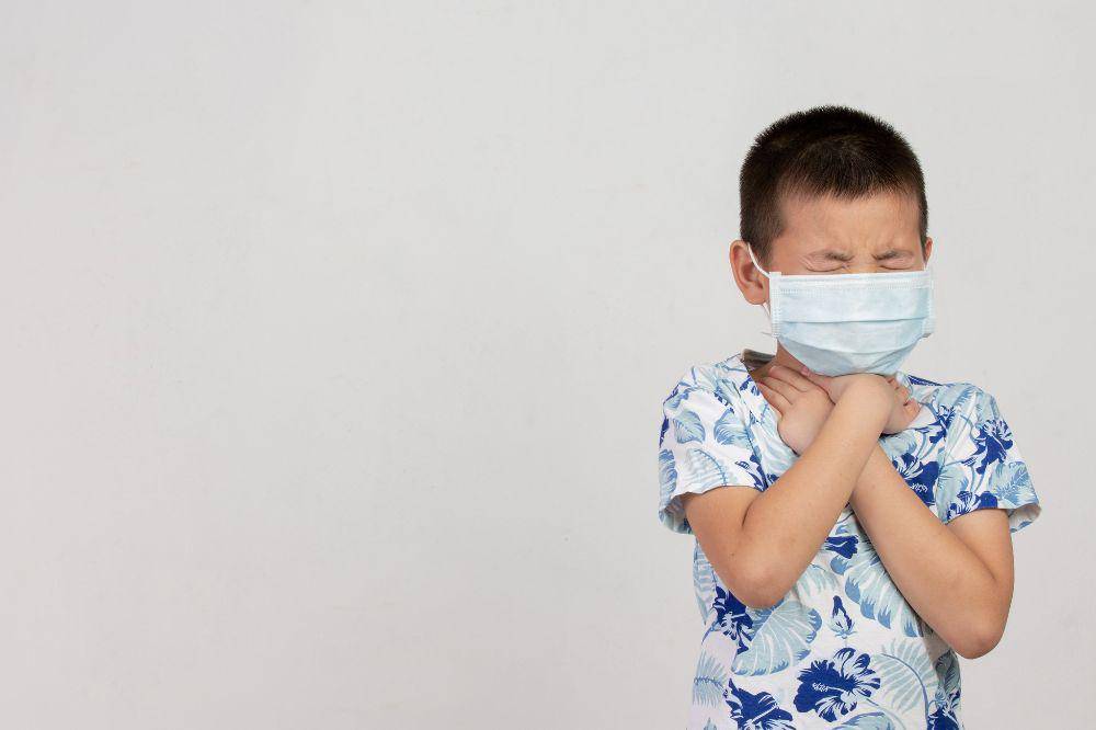 Boy with mask posing