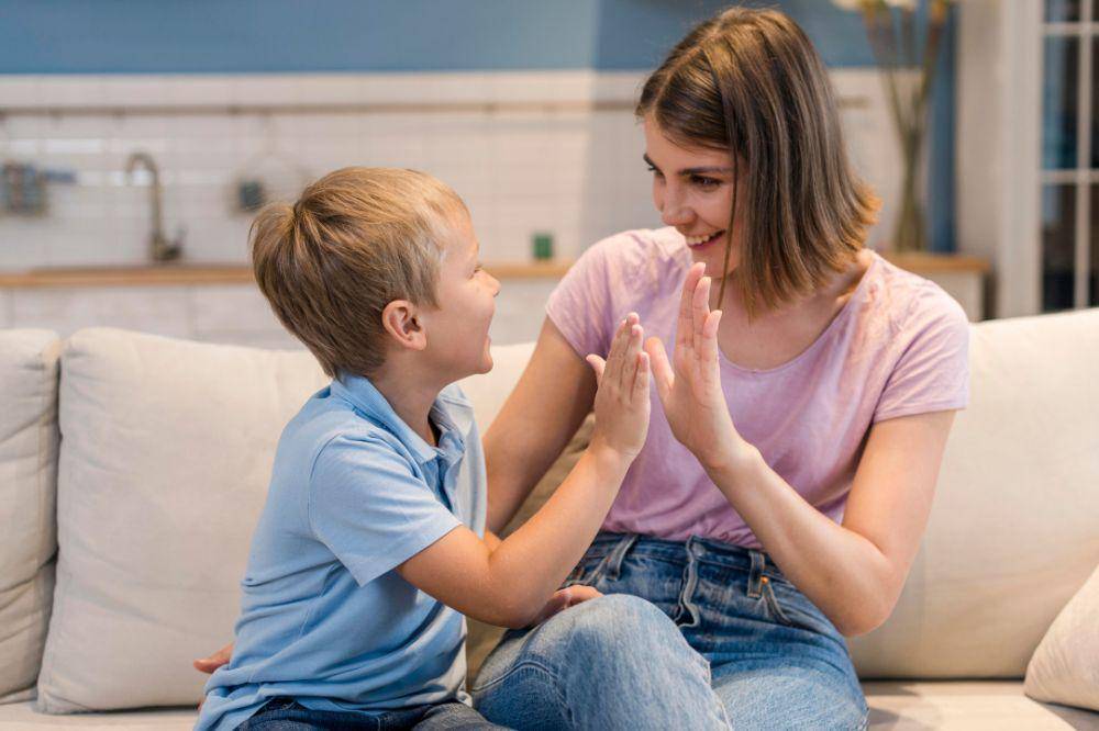 adorable son playing with mom