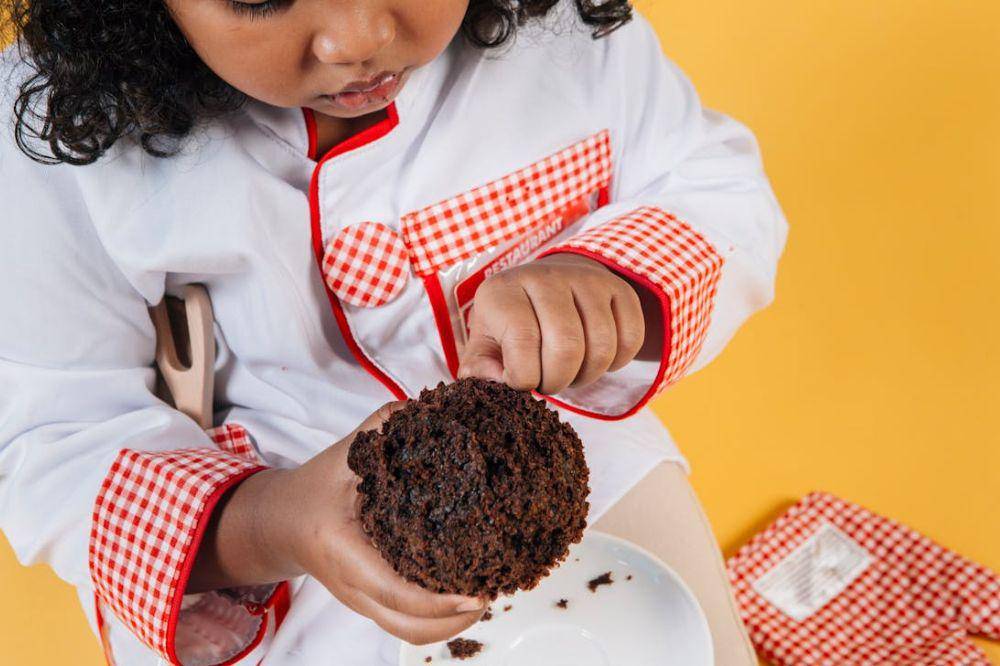 Kid eating chocolate cake