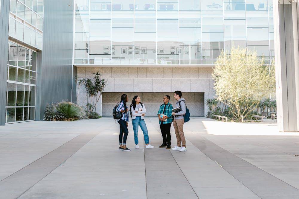 college students standing together on campus