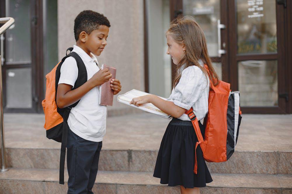 boy and a girl facing each other