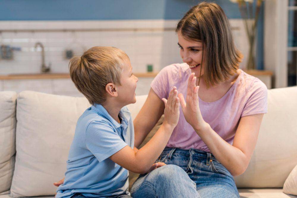 adorable son playing with mom