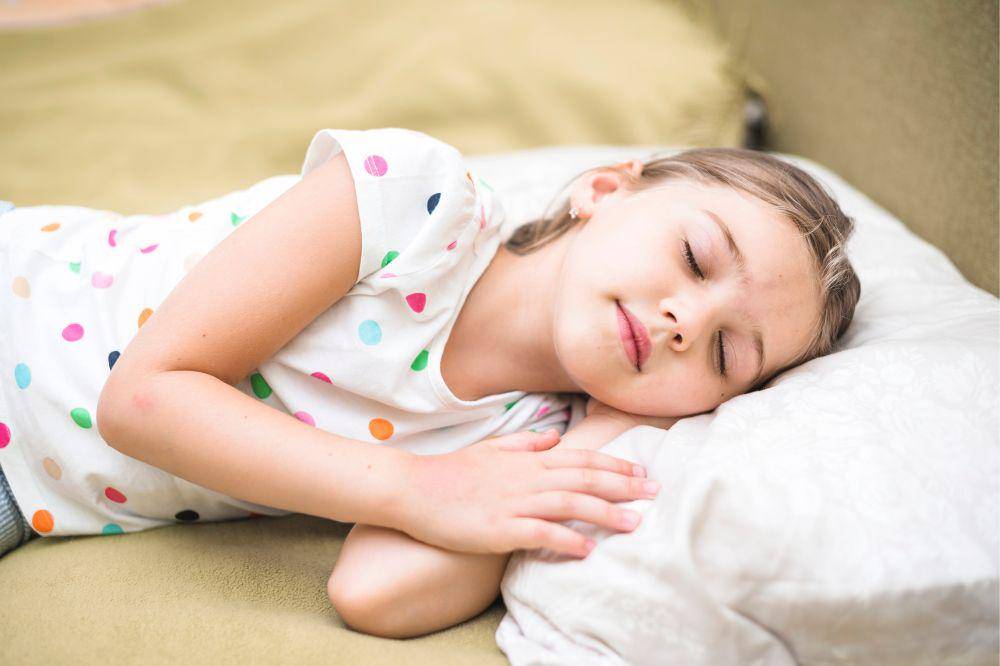 Pretty girl sleeping on cozy bed