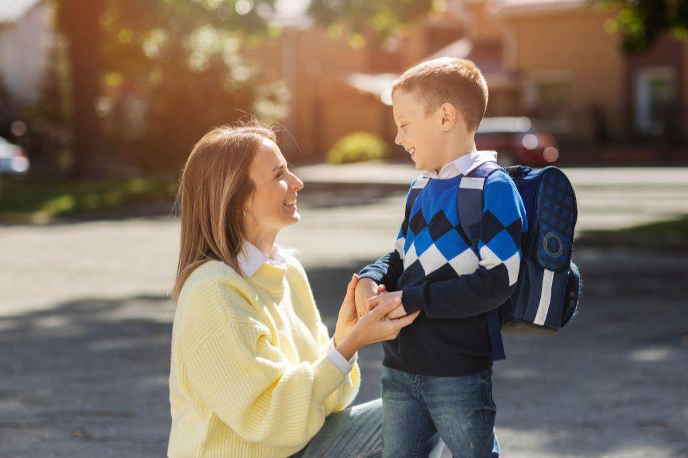 Mother and kid on first school day