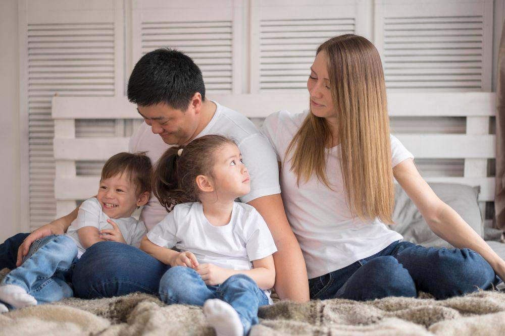 family at home in bed