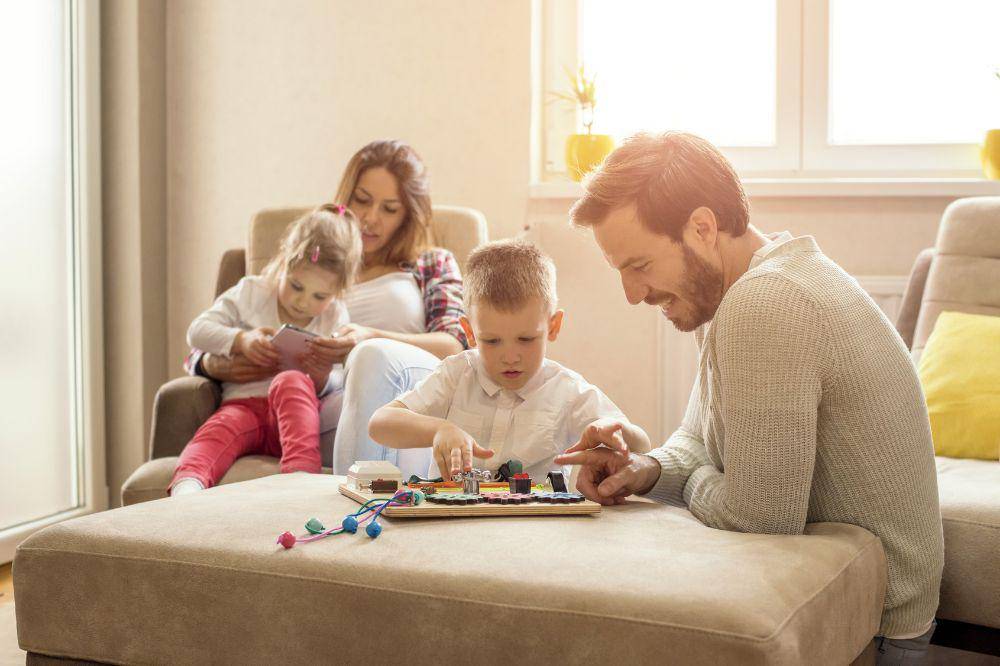 happy family reading and playing