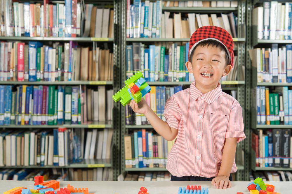 Boy playing with plastic blocks