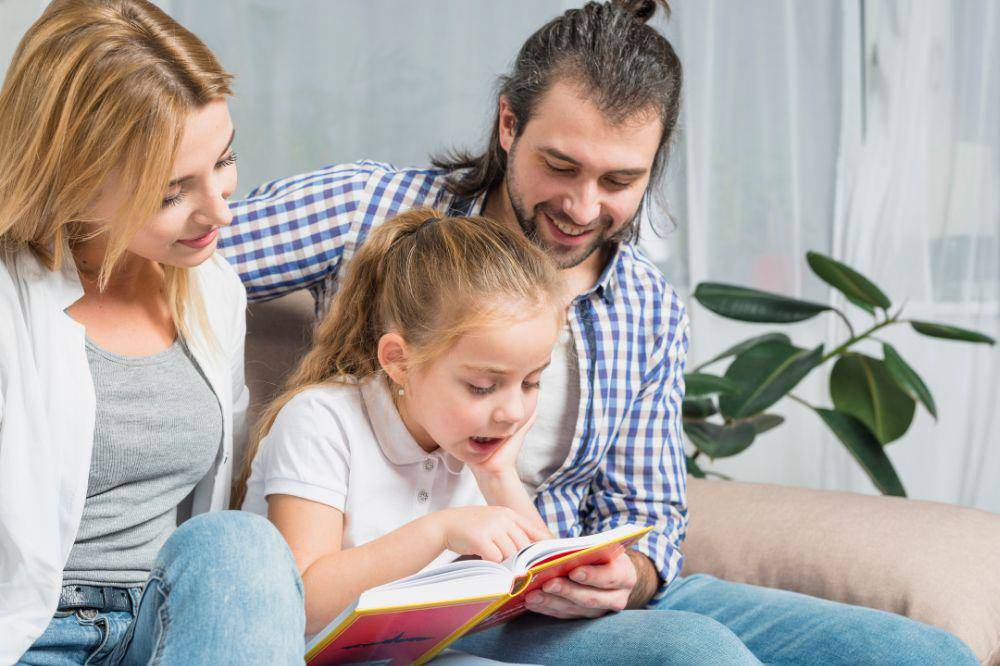 Family reading on the sofa