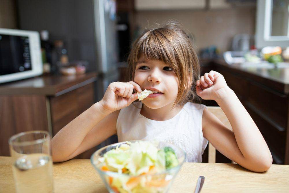 Little girl having healthy food