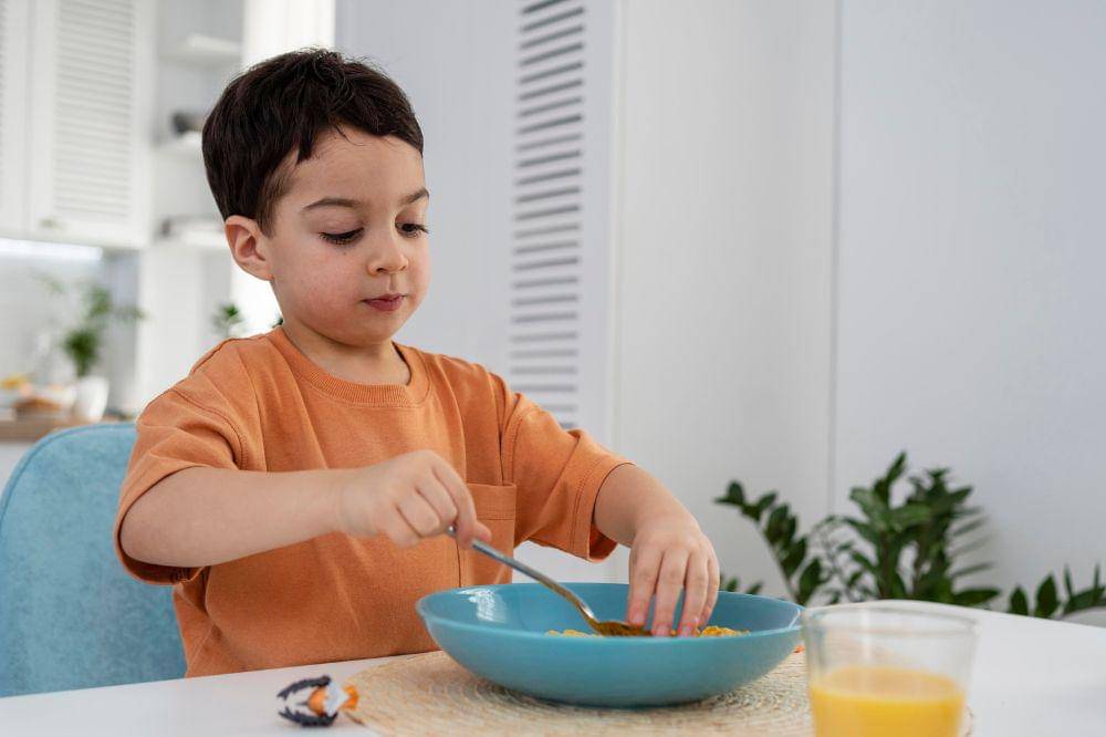 little boy having breakfast