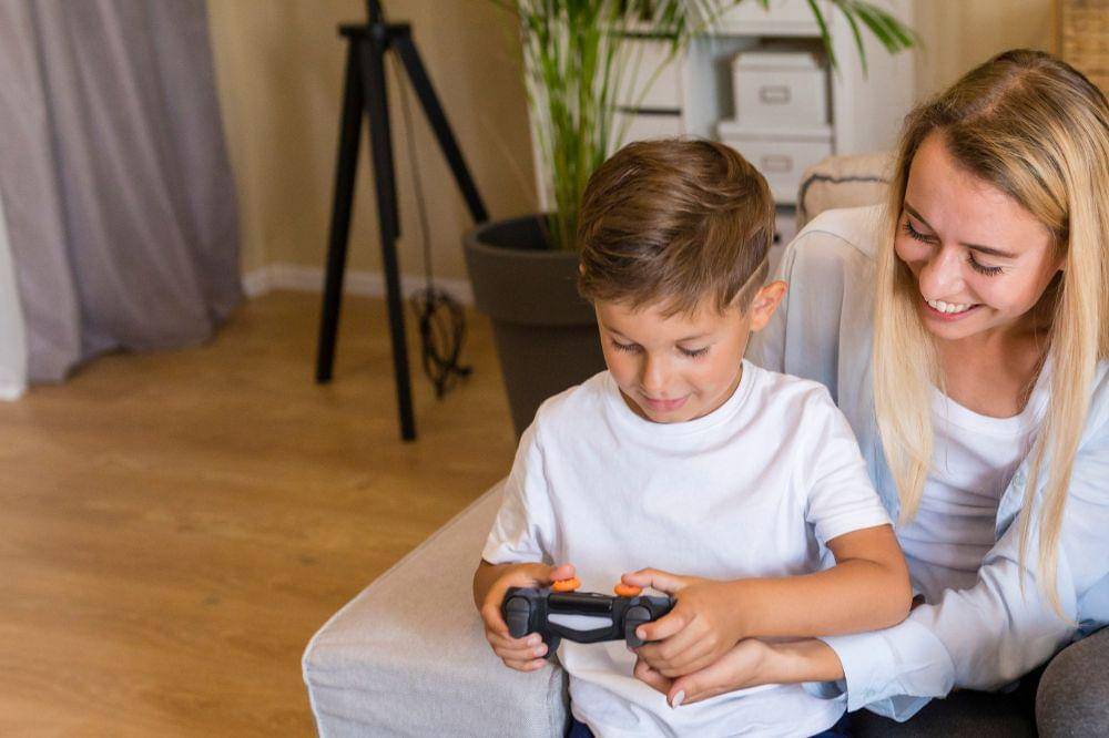 Mother and son playing with a gamepad
