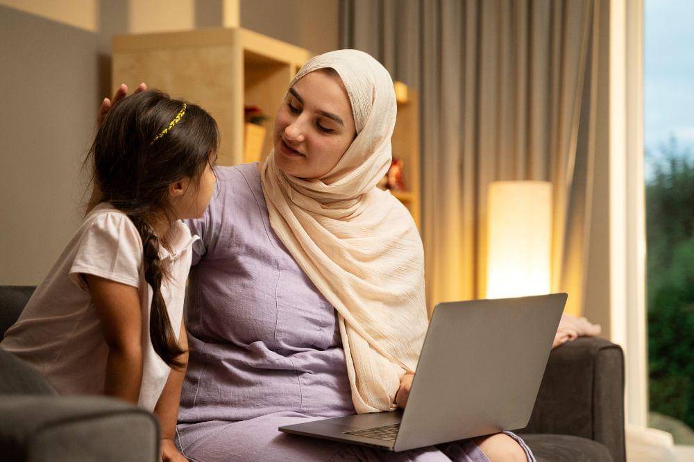 mother and girl with laptop