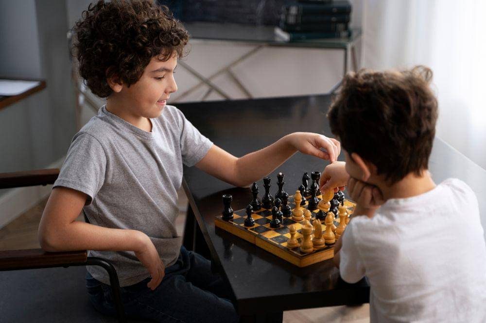 Young kids playing chess together