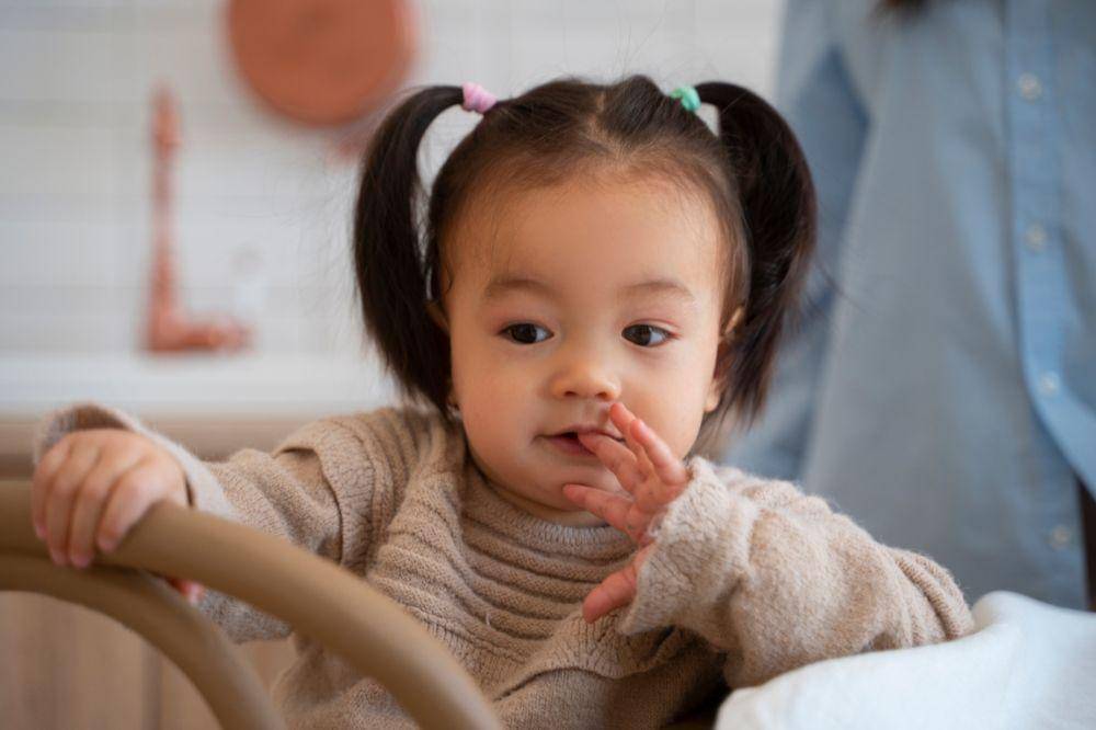 Young asian girl in the kitchen